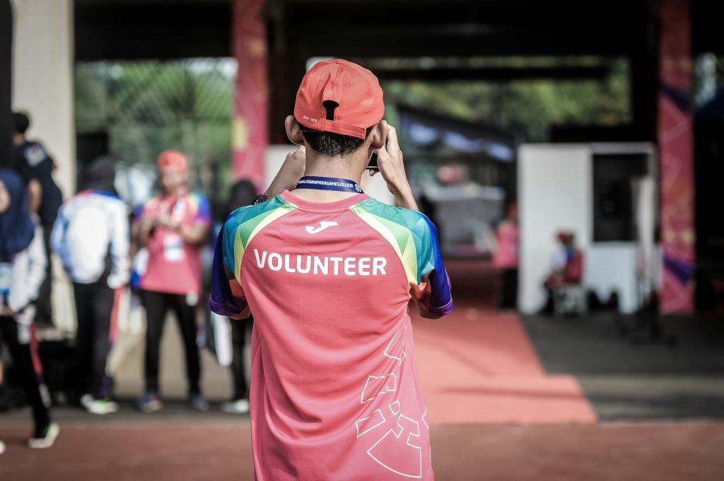 Volunteers joining hands during a community service day