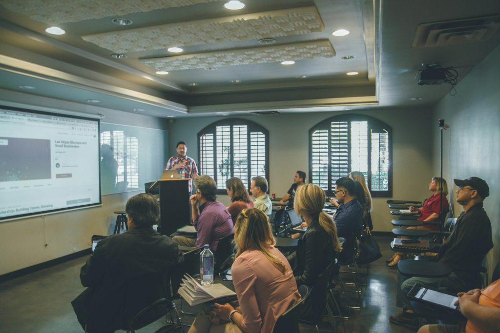 Students listening during a college application workshop