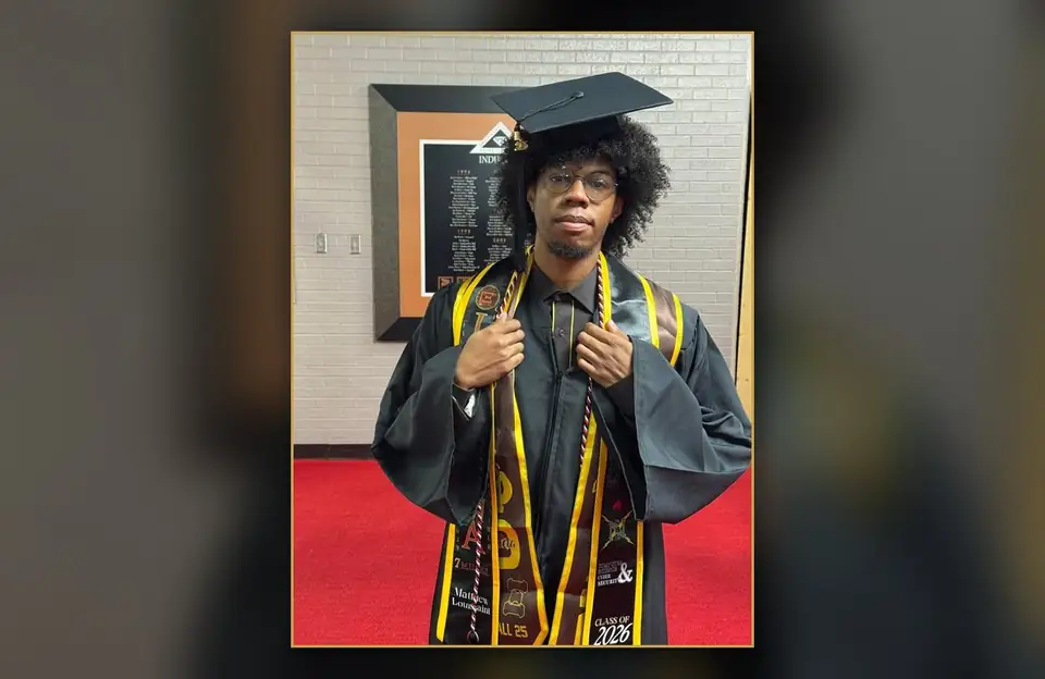 Brother Matthew Louissaint, Class of 2026, in cap and gown wearing his Iota Phi Theta graduation stole
